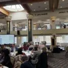 Elizabeth McLaughlin presenting about HMS to a room full of people